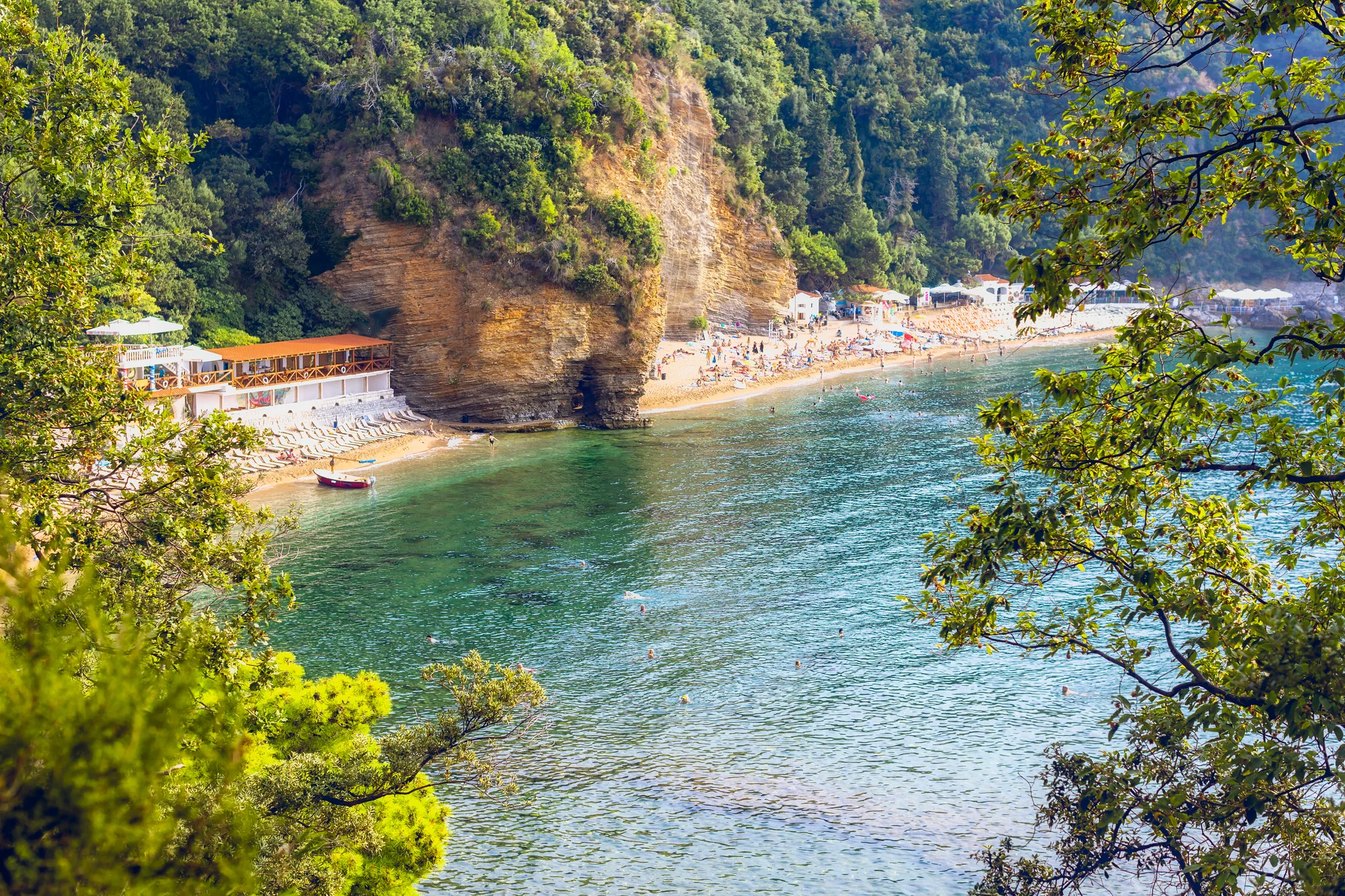 Aerial view of Mogren Beach and the Budva Riviera coastline